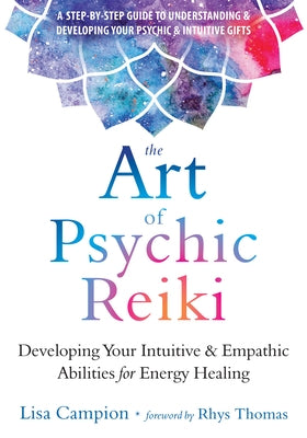 Paperback book titled "The Art of Psychic Reiki" by Reveal Press, featuring a cover with mystical energy symbols.