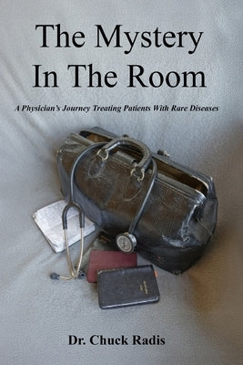 Paperback book titled "The Mystery in the Room" by Sakamo Press, featuring a cover with medical imagery and a medical professional.