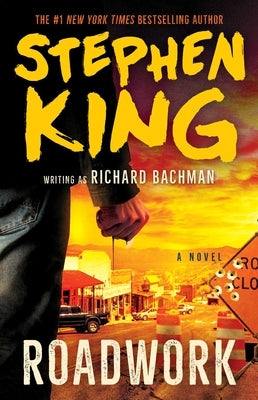 Paperback copy of the novel "Roadwork" by Scribner Book Company, featuring a cover with the title and author details.
