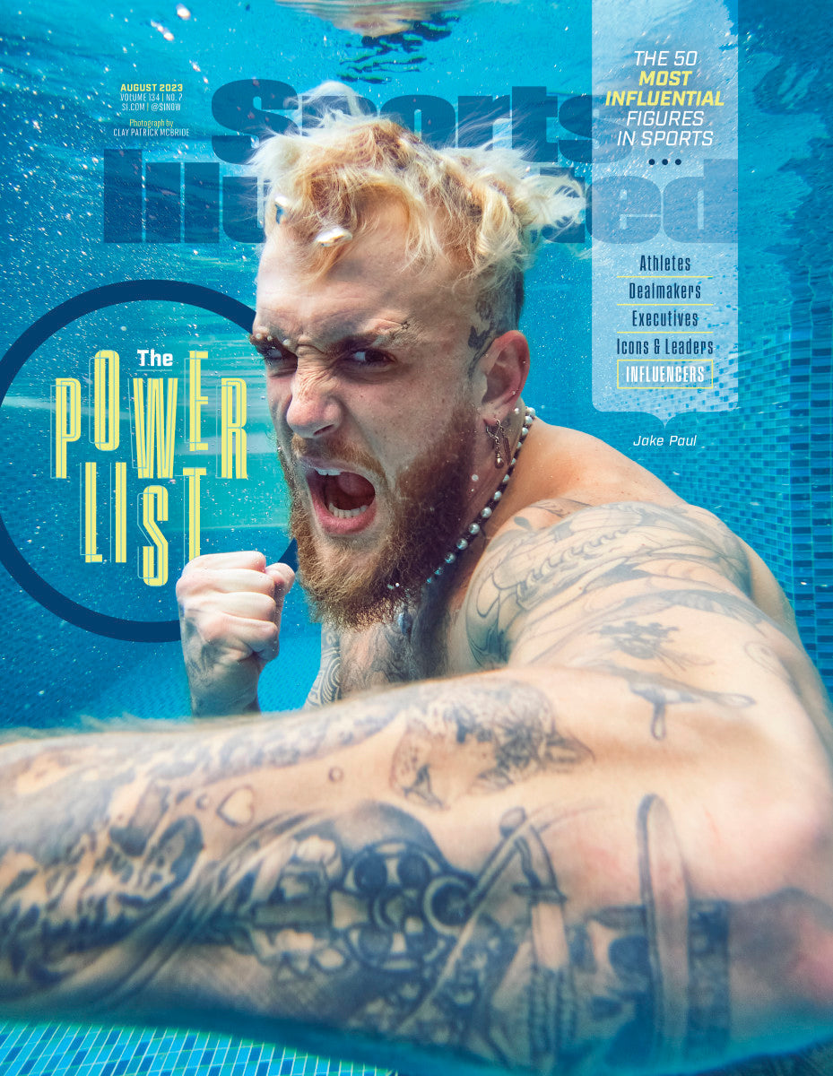 Sports Illustrated magazine cover featuring Jake Paul in action, highlighting sports-themed design and vibrant colors.