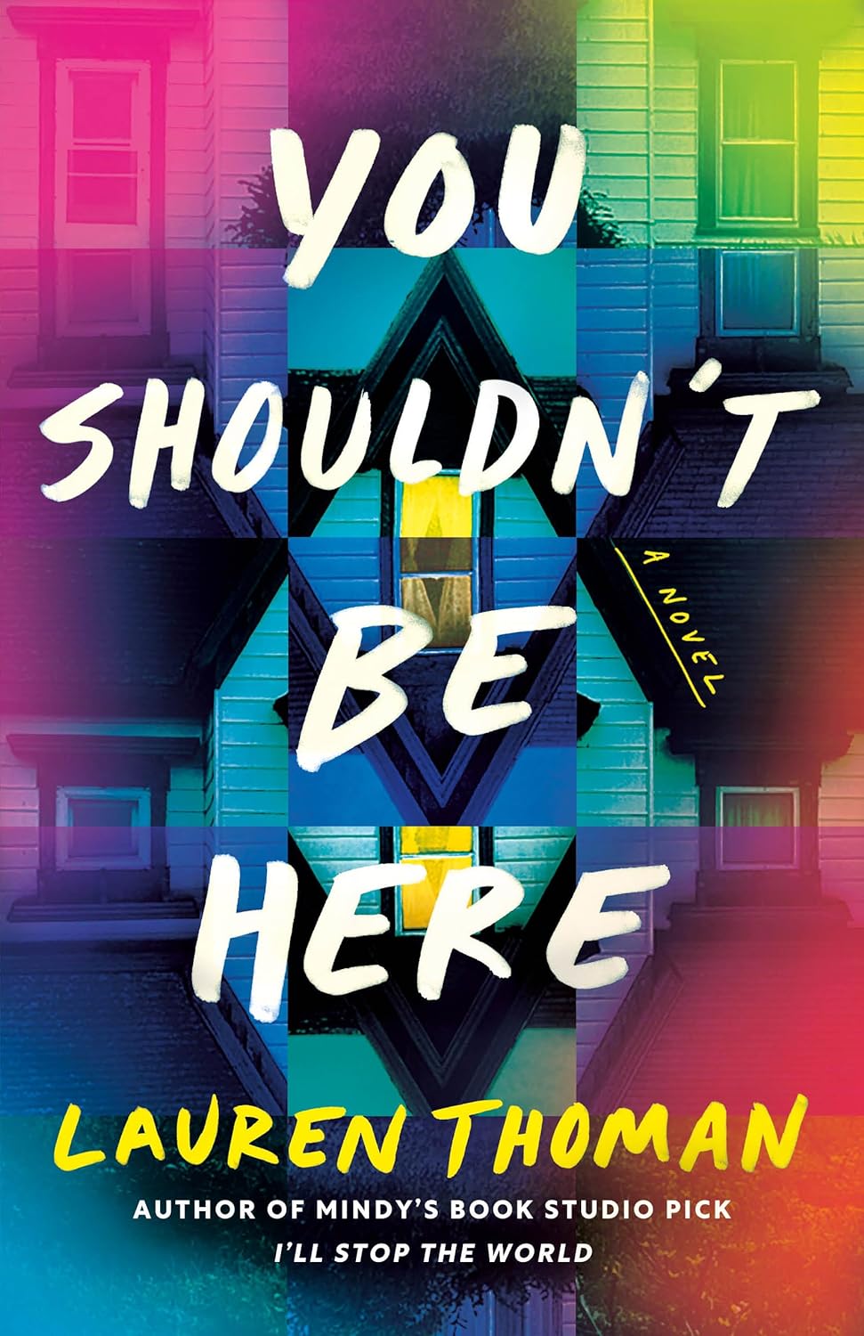 Paperback copy of "You Shouldn't Be Here" by Thomas & Mercer featuring cover art with dark, mysterious imagery.