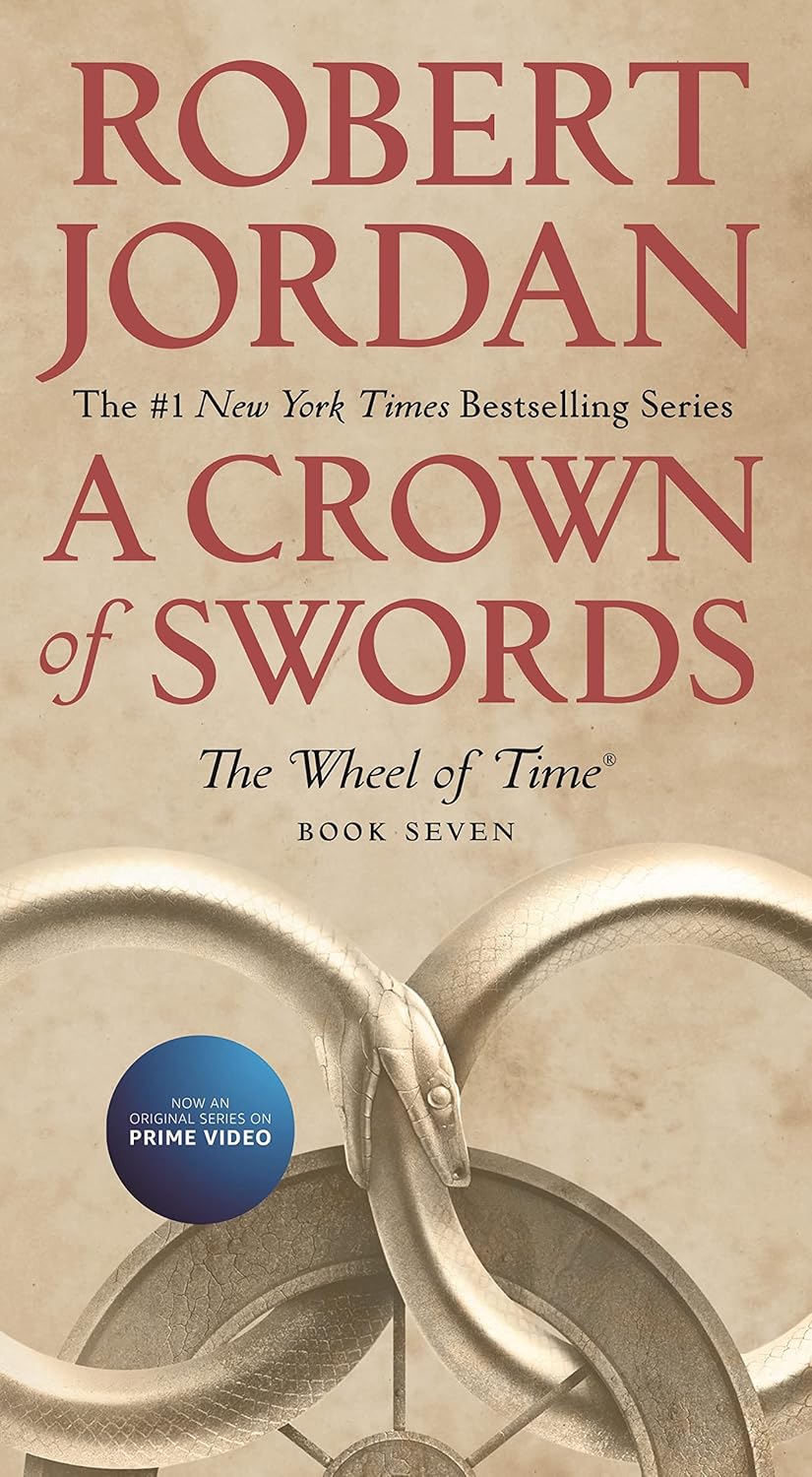 Mass market paperback of "A Crown of Swords" by Tor Fantasy, seventh book in The Wheel of Time series, featuring a detailed cover design.