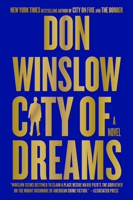 Paperback copy of "City of Dreams" by William Morrow & Company, featuring a cover with cityscape illustrations.