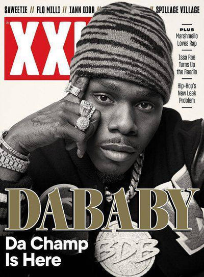 XXL Magazine cover featuring DaBaby, showcasing vibrant colors and bold text highlighting the artist's latest feature.